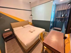 Postel nebo postele na pokoji v ubytování Smile Hotel Subang Airport