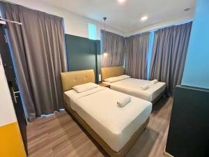 Postel nebo postele na pokoji v ubytování Smile Hotel Subang Airport