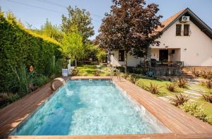 a swimming pool in the backyard of a house at Villa Base Kırkpınar Detached Villa with pool in Sapanca