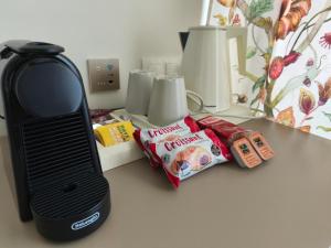 a kitchen counter with a black blender and some food at The Archontariki in Ormos Panagias