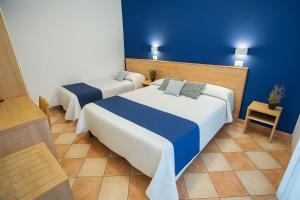 Postel nebo postele na pokoji v ubytování Hotel Aldebaran