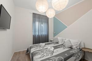 En eller flere senge i et værelse på Apartment Fiorella