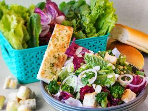 a salad with a sandwich on top of it at ibis Brussels Centre Chatelain in Brussels