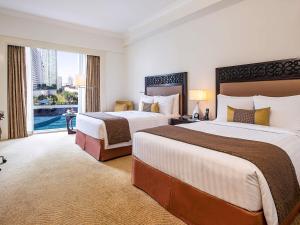 Postel nebo postele na pokoji v ubytování Fairmont Makati