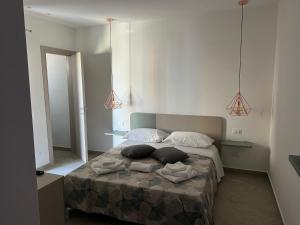 Postel nebo postele na pokoji v ubytování Lapis rooms