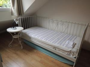 En eller flere senge i et værelse på Vakantie appartement Paedshof Ransdaal