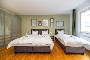 Katil atau katil-katil dalam bilik di Central Apartments with private parking lot +64 gambar