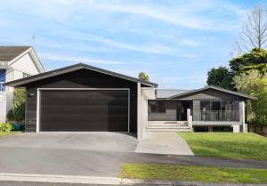a house with a large garage at All Black # 10 in Hamilton