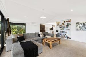 a living room with a couch and a coffee table at All Black # 10 in Hamilton