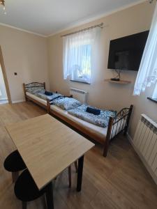 Postel nebo postele na pokoji v ubytování Pokoje Gościnne Baśniowy Dom Radków
