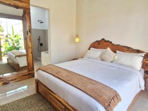 Postel nebo postele na pokoji v ubytování Peaceful 2BR House with Rice Field View Near Beach & Local Spots