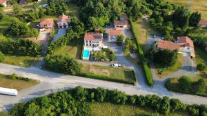 an aerial view of a house with a pool at Guest House Surina App Surina's Green Holiday in Rupa
