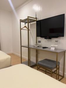 TV a/nebo společenská místnost v ubytování ILOILO GRAND HOTEL