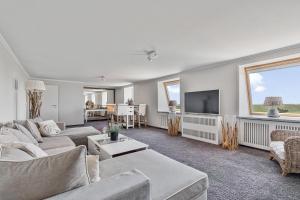 TV a/nebo společenská místnost v ubytování Hotel Strand No.1