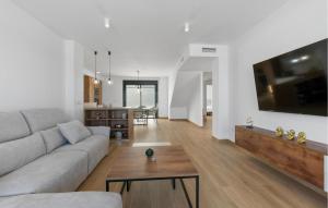 a living room with a couch and a table at Amazing Home In San Javier in San Javier