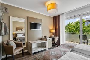 Postel nebo postele na pokoji v ubytování Hotel Strand No.1