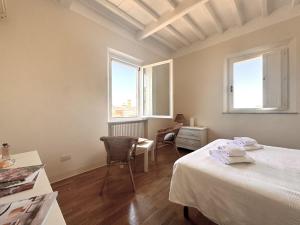 Voodi või voodid majutusasutuse Dimora con vista sulla Torre del Mangia toas