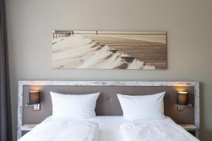 Postel nebo postele na pokoji v ubytování Hotel Strand No.1
