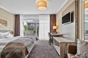 Postel nebo postele na pokoji v ubytování Hotel Strand No.1