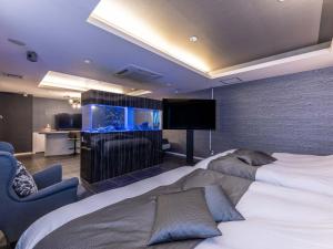 TV a/nebo společenská místnost v ubytování HOTEL felice Osaka -伊丹空港-