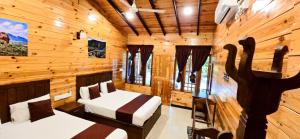 Katil atau katil-katil dalam bilik di Elvis Beach Resort