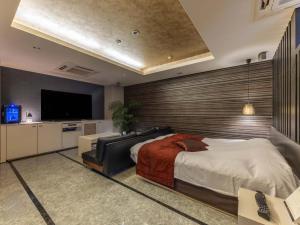 Postel nebo postele na pokoji v ubytování HOTEL felice Osaka -伊丹空港-