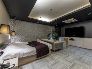 Postel nebo postele na pokoji v ubytování HOTEL felice Osaka -伊丹空港-