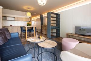 a living room with a couch and a table at Ferienwohnungen Hafenresidenz Alter Speicher Lauterbach in Putbus