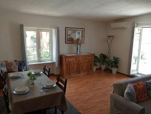 a living room with a table and a couch at Casa Else in Massa Lubrense
