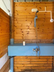 a wooden wall with a shower in a room at Borsh Olive Camping in Borsh +67 photos