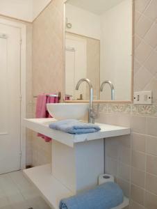 a bathroom with a sink and a mirror at Casa Else in Massa Lubrense +31 photos