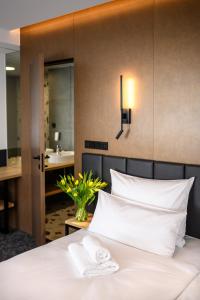 Postel nebo postele na pokoji v ubytování Harmony Club Hotel