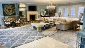a living room with a couch and a fireplace at Private Studio Style & Bedroom View Pool Big Estate Oasis Extra Fee 4 Guest Clea-ning Pet WOMEN ONLY in Los Angeles