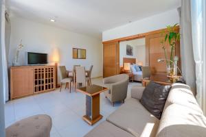 Televízia a/alebo spoločenská miestnosť v ubytovaní Adriatic Deluxe Apartments