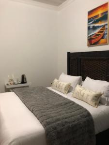 Postel nebo postele na pokoji v ubytování Malebo Guest House