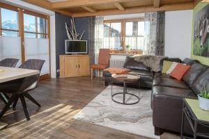 TV a/nebo společenská místnost v ubytování Eldorado - Ferienwohnungen & Suiten