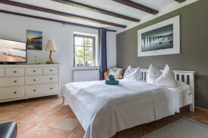 Postel nebo postele na pokoji v ubytování Ferienwohnung "Ostseewind" + 23 fotografií