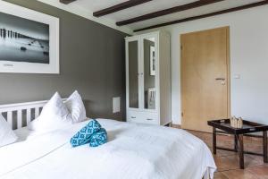 Postel nebo postele na pokoji v ubytování Ferienwohnung "Ostseewind"