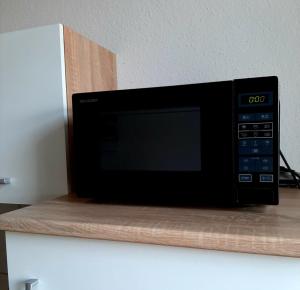 TV a/nebo společenská místnost v ubytování MARTHA APARTMENTS - Ideal für Familien und Langzeitaufenthalte