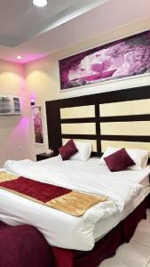 Postel nebo postele na pokoji v ubytování Al Majaridah Hotel