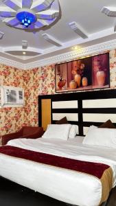 Postel nebo postele na pokoji v ubytování Al Majaridah Hotel