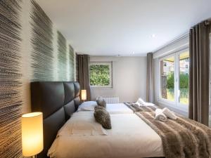 Posteľ alebo postele v izbe v ubytovaní Appartement chic avec sauna et parking au centre de Chamonix - FR-1-343-190