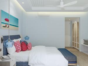 Postel nebo postele na pokoji v ubytování Eri Maldives