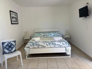 Posteľ alebo postele v izbe v ubytovaní Le Torrette Rooms and Apartments