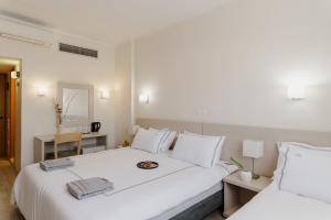 Postel nebo postele na pokoji v ubytování Nestos Hotel + 37 fotografií