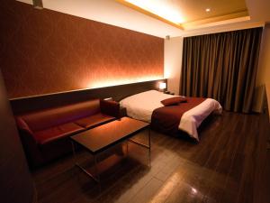 Postel nebo postele na pokoji v ubytování HOTEL felice Osaka -伊丹空港-