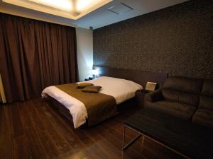 Postel nebo postele na pokoji v ubytování HOTEL felice Osaka -伊丹空港-