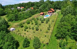 an aerial view of a house on a hill with trees at Holiday Home Dubranec by Villas Guide in Dubranec