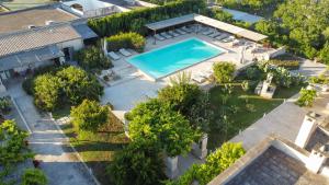 an overhead view of a swimming pool in a yard at Masseria Borgo Sentinella in Torre dell'Orso