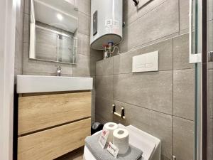 a small bathroom with a sink and a toilet at Portimao Central Town 2 by Homing in Portimão